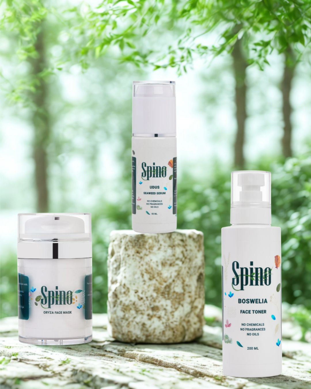 Spino essential skincare bundle on a stone surface with a natural background